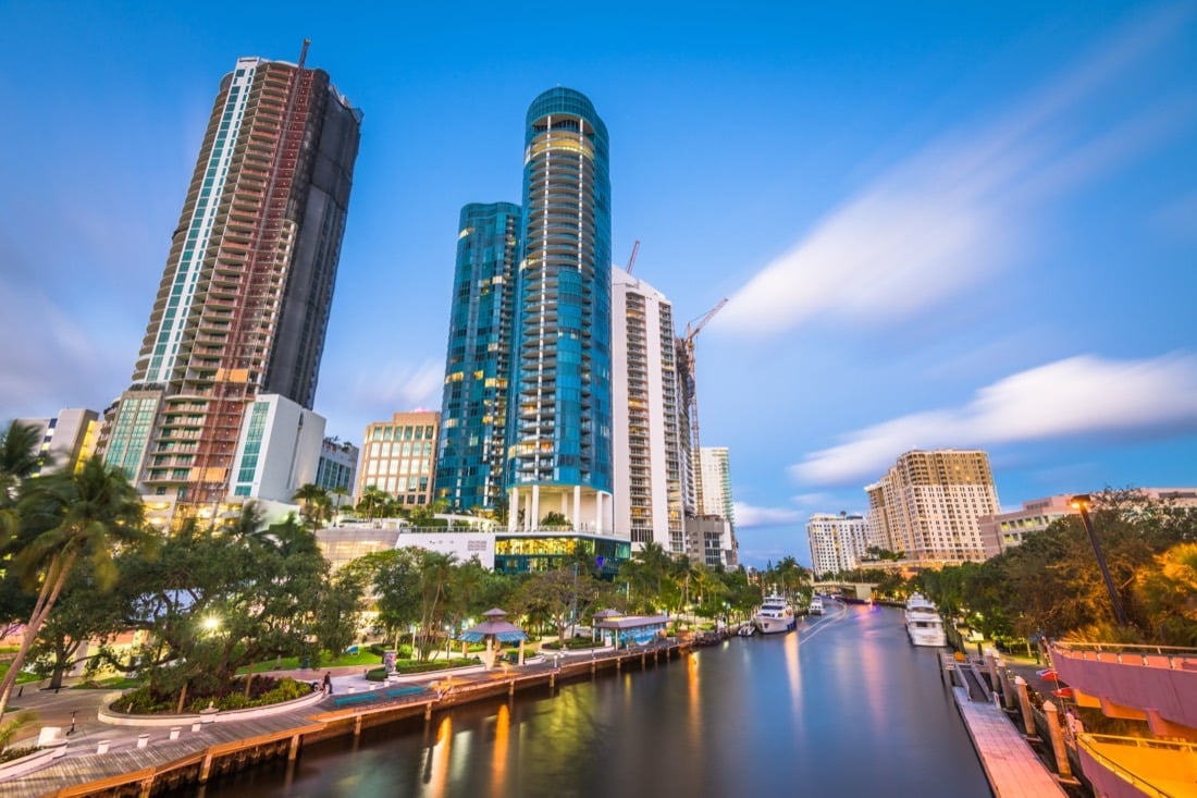 High-rise towers along the Fort Lauderdale waterfront at dusk.